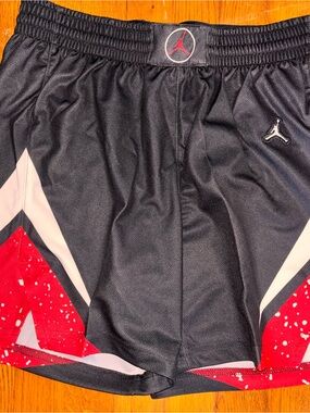 New Jordan Women’s Medium Basketball shorts with red, white, and black detail